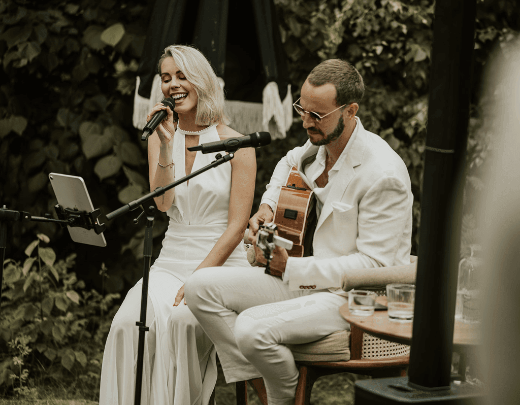 Acoustic wedding duo performing live - female singer and guitarist at a ceremony
